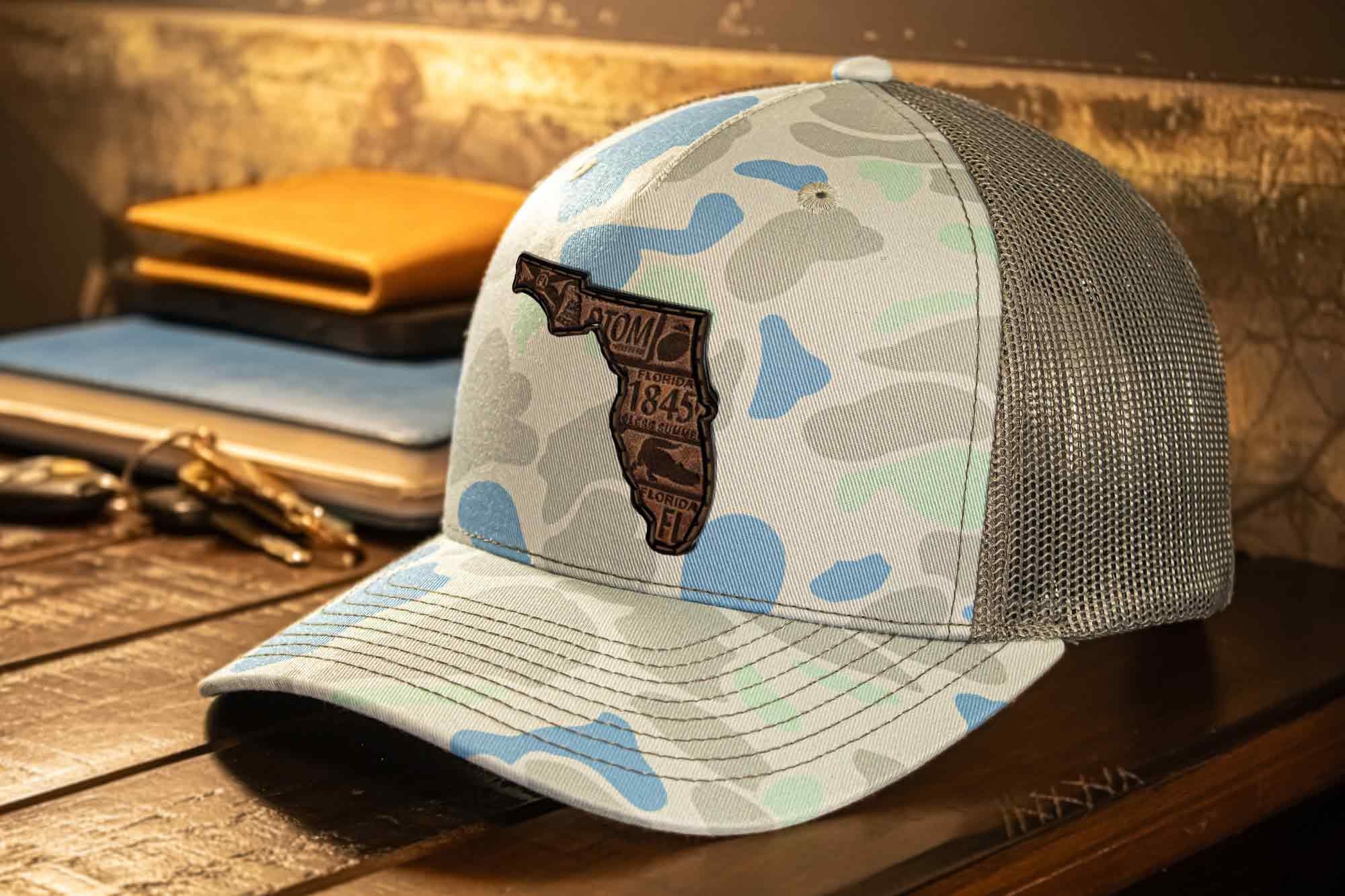 Florida Map Old School Camo Trucker Hat. Burnished Full Grain Leather Patch. 5-Panel Richardson 112 Snapback Cap. Stitched Map Patch.