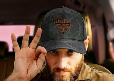 South Carolina Map Old School Camo Trucker Hat. Burnished Full Grain Leather Patch. 5-Panel Richardson 112 Snapback Cap. Stitched Map Patch.