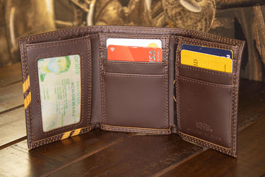 Texas Longhorns Men's Embossed Leather Wallet. Texas Trifold. Longhorns Secretary. Brown Collegiate Wallet. Longhorns Athletic Print.