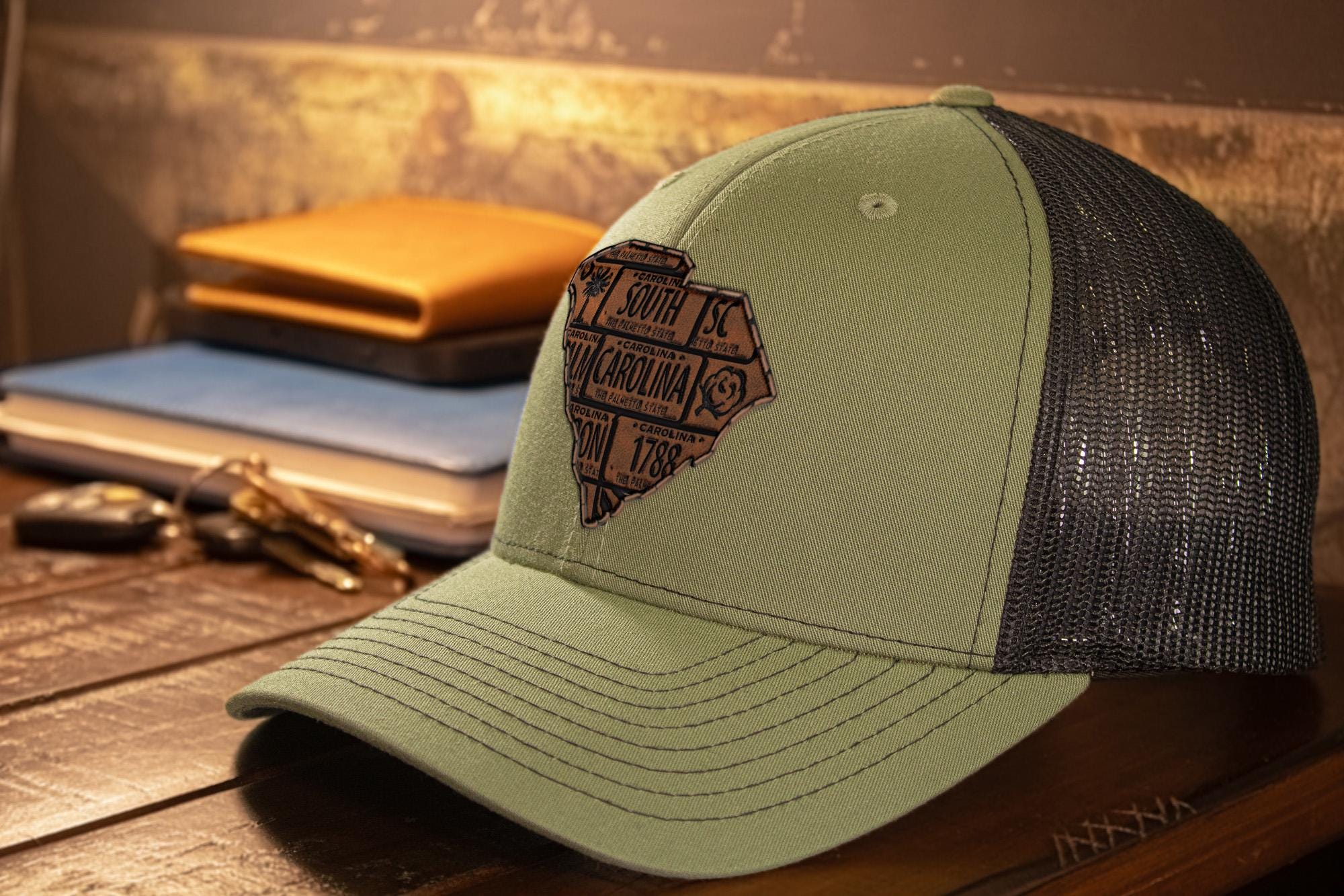 South Carolina Map Leather Patch Trucker Hat. Burnished Full Grain Leather. Snapback Trucker Hat. Richardson 112 Cap. SC State Headwear.