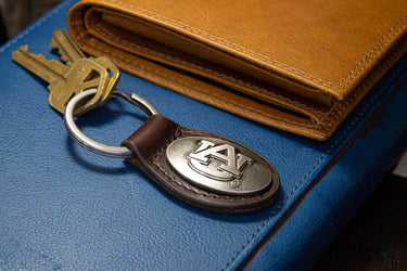 Auburn Tigers Oval Leather Key Fob. Sturdy Split Ring and Durable Stitching. Perfect Collegiate Key Chain Gift. Brown or Black Leather.