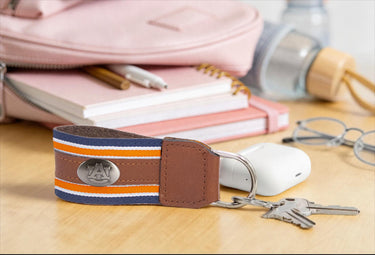 Auburn Tigers Collegiate Grosgrain Ribbon Key Chain with Leather Accent and Silver Emblem.
