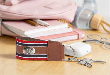 Ohio State Buckeyes Collegiate Grosgrain Ribbon Key Chain with Leather Accent and Silver Emblem.