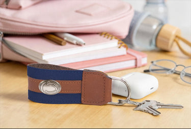 Penn State Nittany Lions Collegiate Grosgrain Ribbon Key Chain with Leather Accent and Silver Emblem.