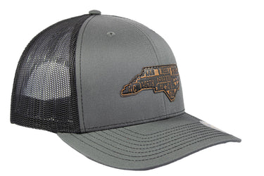 North Carolina Map Leather Patch Trucker Hat. Burnished Full Grain Leather. Snapback Trucker Hat. Richardson 112 Cap. NC Headwear.