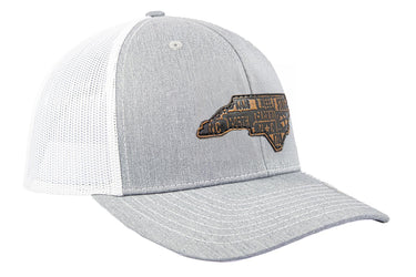 North Carolina Map Leather Patch Trucker Hat. Burnished Full Grain Leather. Snapback Trucker Hat. Richardson 112 Cap. NC Headwear.