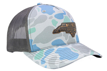 North Carolina Map Old School Camo Trucker Hat. Burnished Full Grain Leather Patch. 5-Panel Richardson 112 Snapback Cap. Stitched Map Patch.