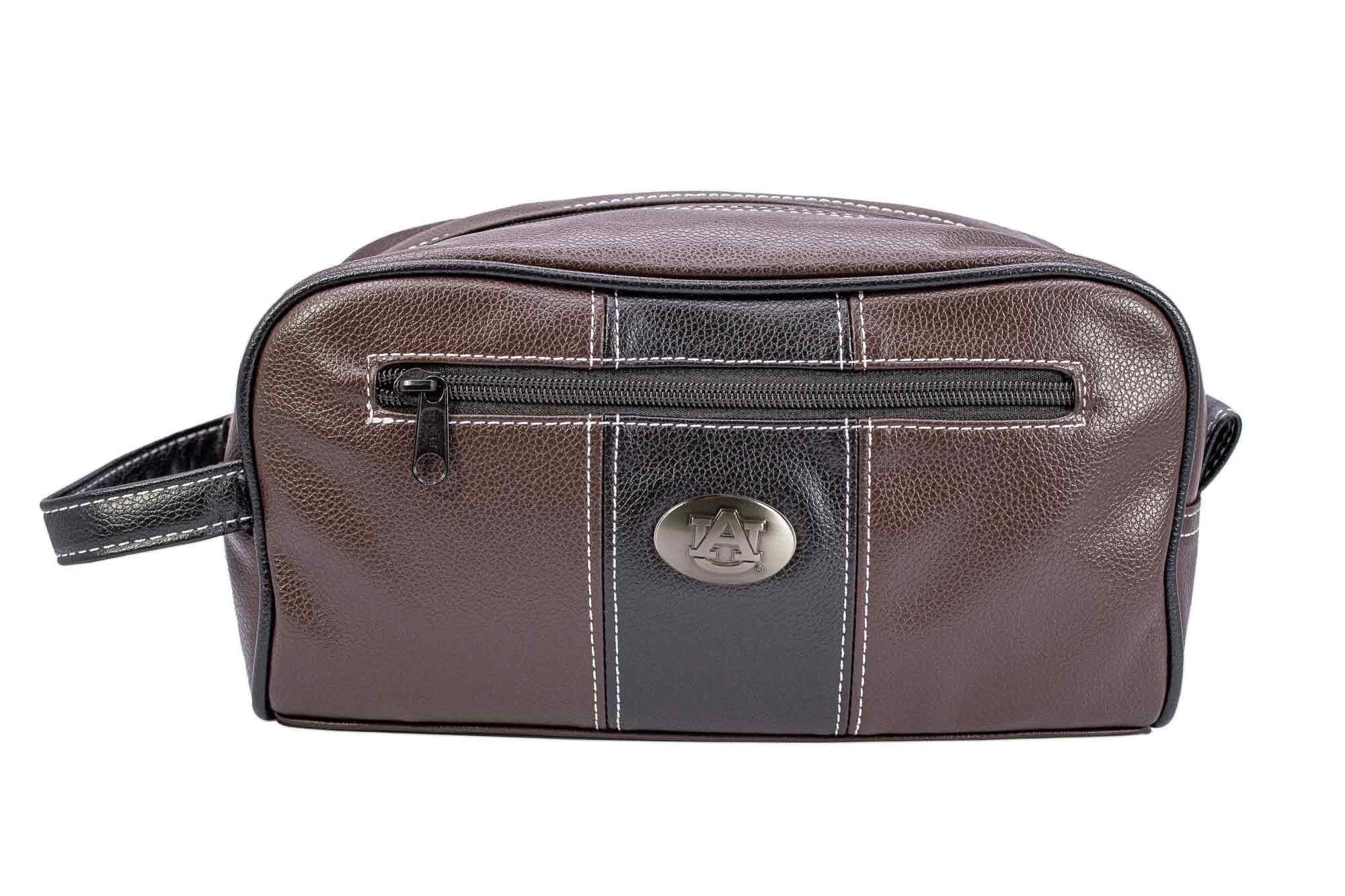 Auburn Tigers Men's Toiletry Dopp Bag. Brown Pebble PU Finish. Auburn Silver Logo. Durable Water Resistant. Compact and Spacious Design.
