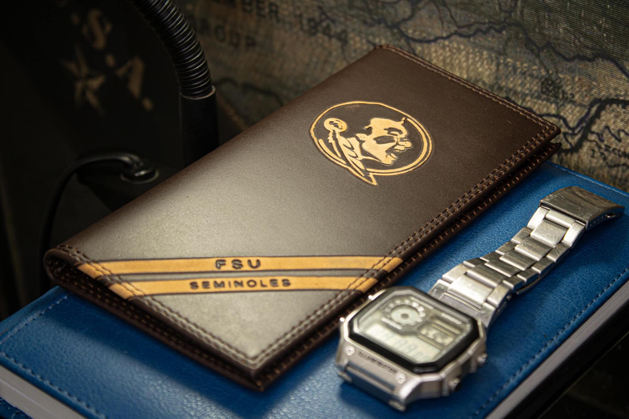 FSU Seminoles Men's Embossed Leather Wallet. FSU Trifold. FSU Secretary. Brown Collegiate Wallet. Seminoles Athletic Print.