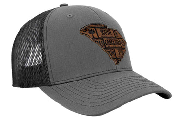 South Carolina Map Leather Patch Trucker Hat. Burnished Full Grain Leather. Snapback Trucker Hat. Richardson 112 Cap. SC State Headwear.