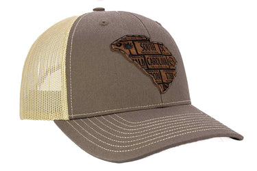South Carolina Map Leather Patch Trucker Hat. Burnished Full Grain Leather. Snapback Trucker Hat. Richardson 112 Cap. SC State Headwear.