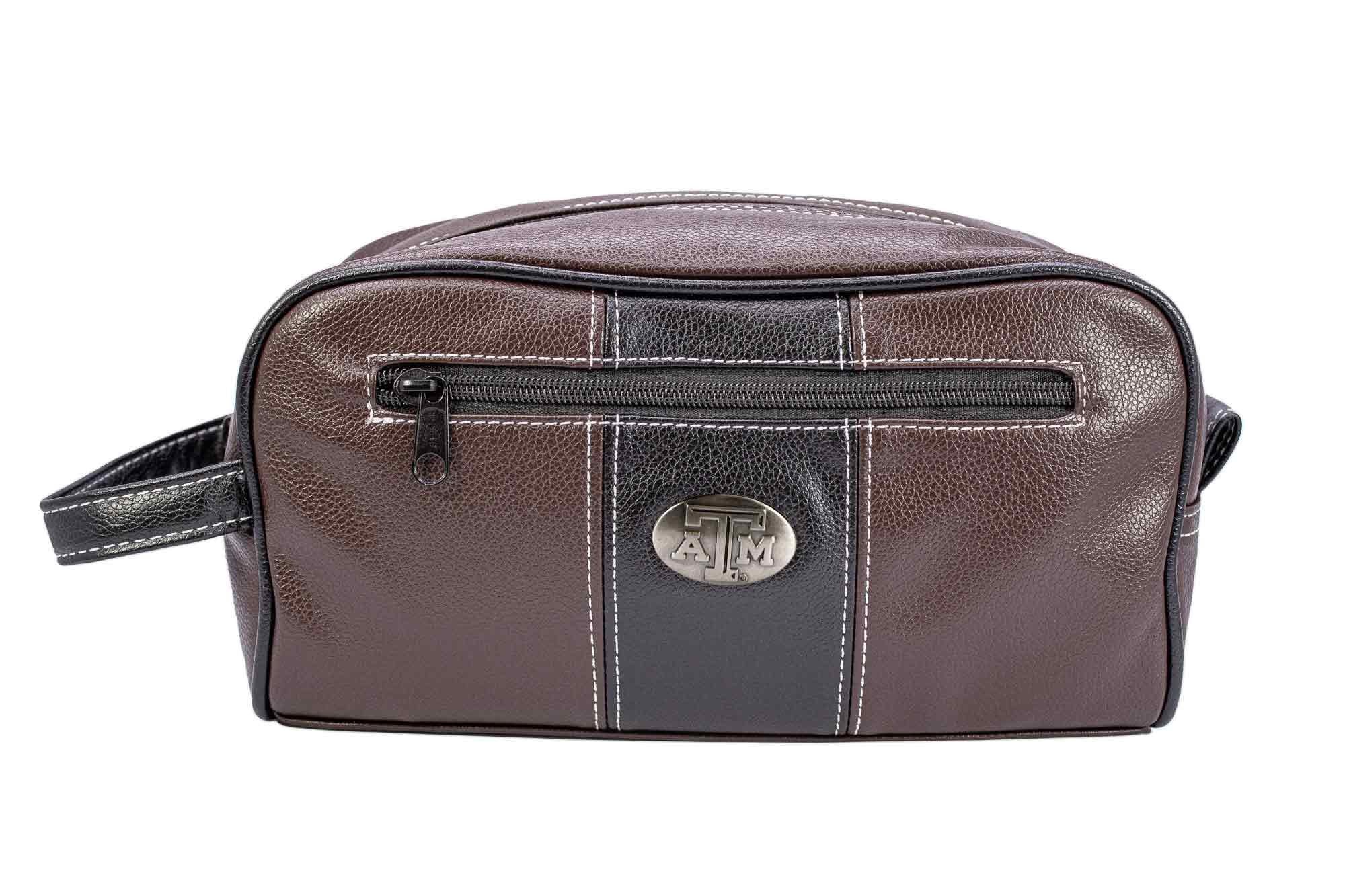 Texas A&M Aggies Men's Toiletry Dopp Bag. Brown Pebble PU Finish. Aggies Silver Logo. Durable Water Resistant. Compact and Spacious Design.