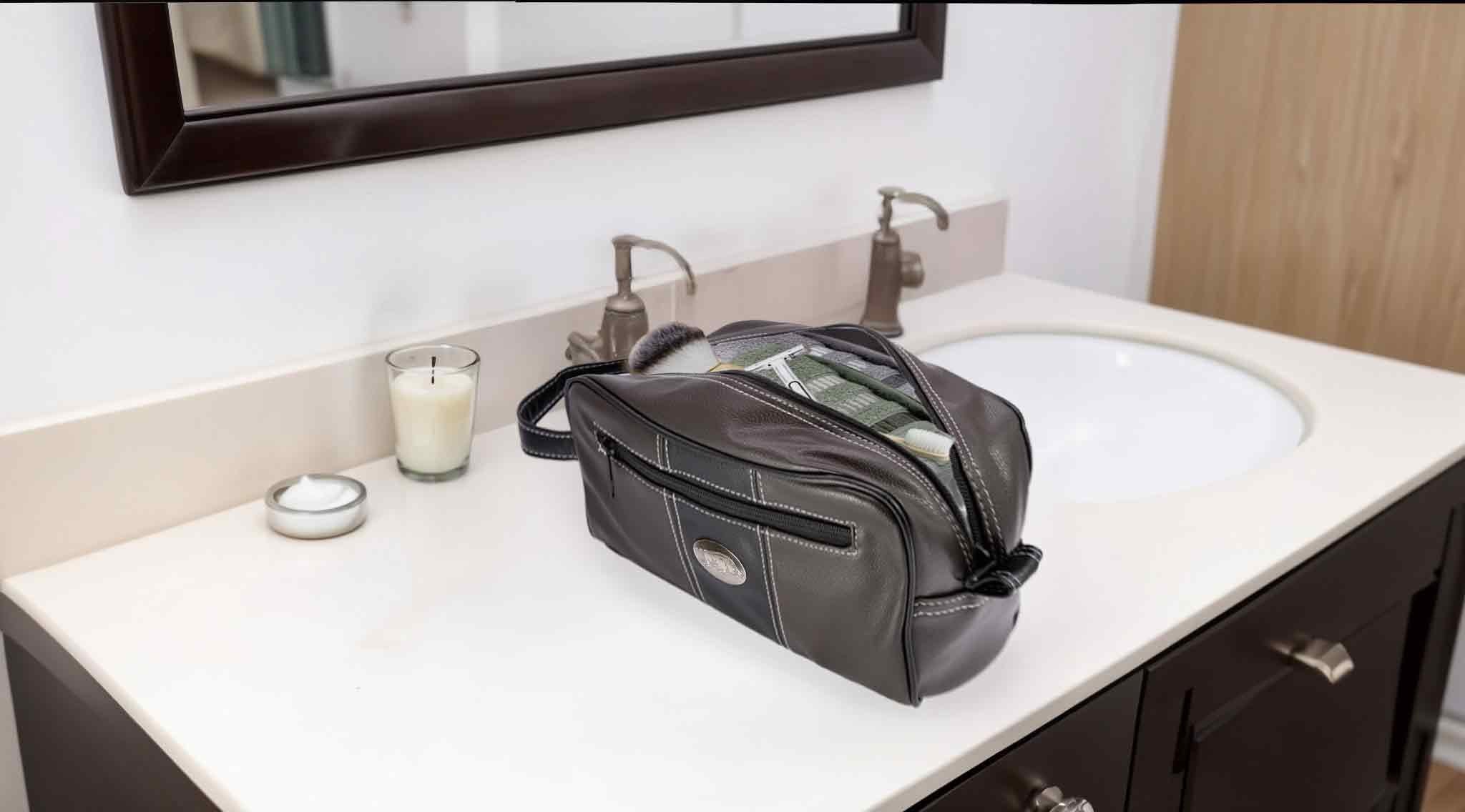 Arkansas Razorbacks Men's Toiletry Dopp Bag. Brown Pebble PU Finish. ARK Silver Logo. Durable Water Resistant. Compact and Spacious Design.