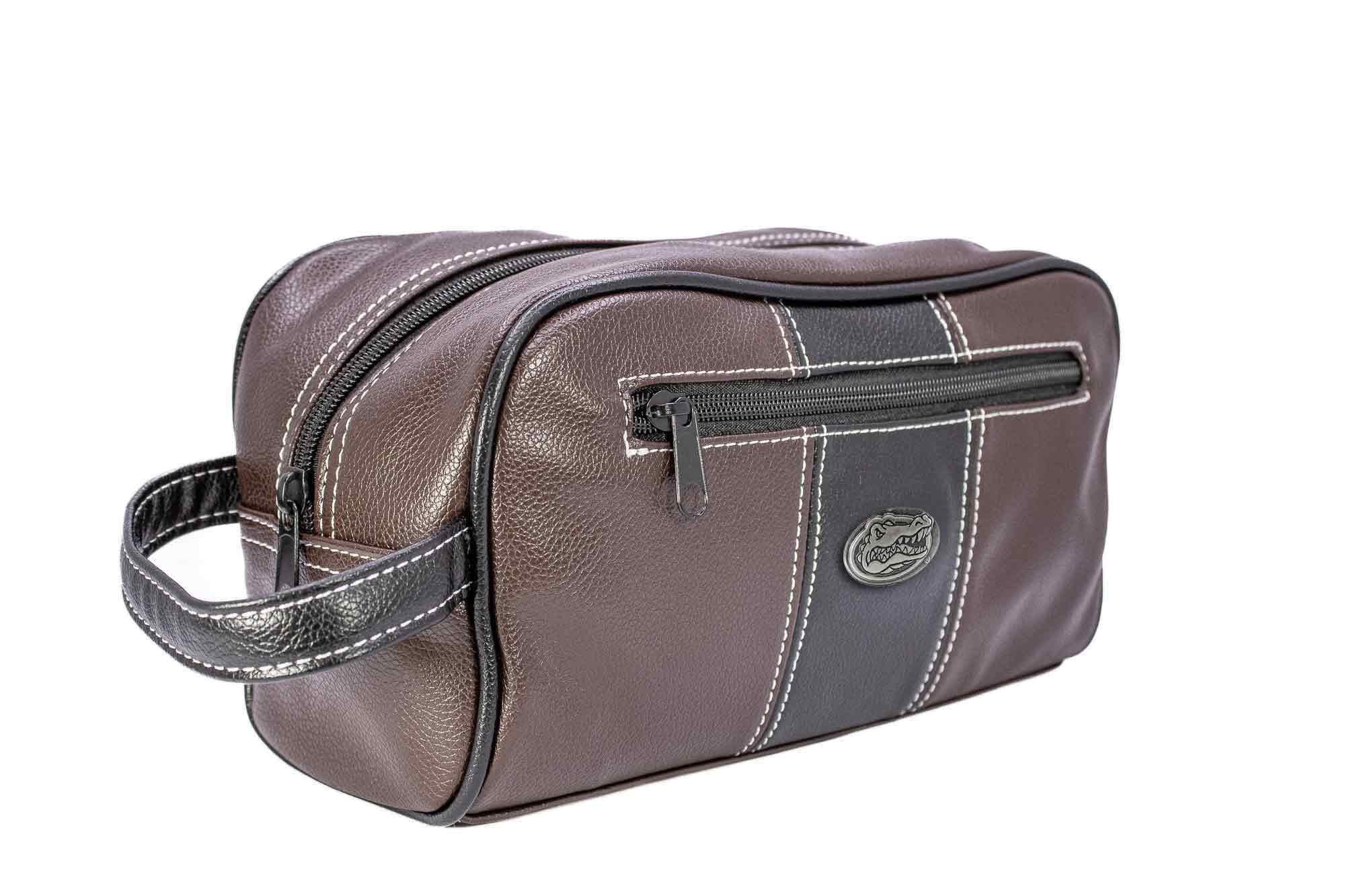 Florida Gators Men's Toiletry Dopp Bag. Brown Pebble PU Finish. UF Silver Logo. Durable Water Resistant. Compact and Spacious Design.
