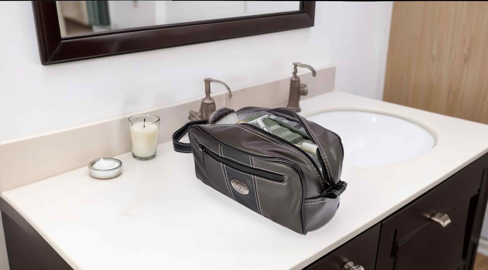 Virginia Tech Hokies Men's Toiletry Dopp Bag. Brown Pebble PU Finish. Hokies Silver Logo. Durable Water Resistant. Spacious Design.