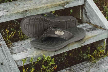 Dolphin Men's Flip Flop Sandal. Casual Boat Show. Fishing Gift. Brown Straps With Metal Concho Logo. Cushioned Insole and Non-skid Outsole.