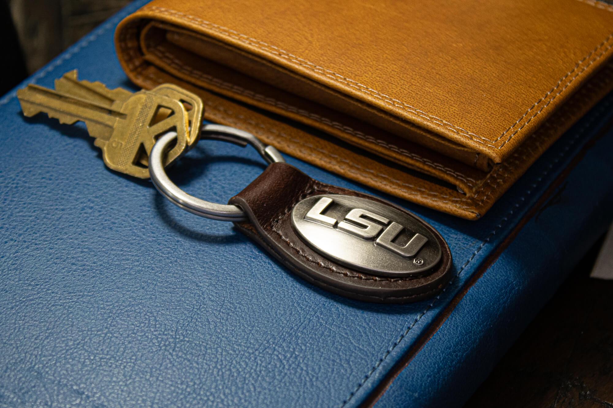 LSU Tigers Oval Leather Key Fob. Sturdy Split Ring and Durable Stitching. Perfect Collegiate Key Chain Gift. Brown or Black Leather.