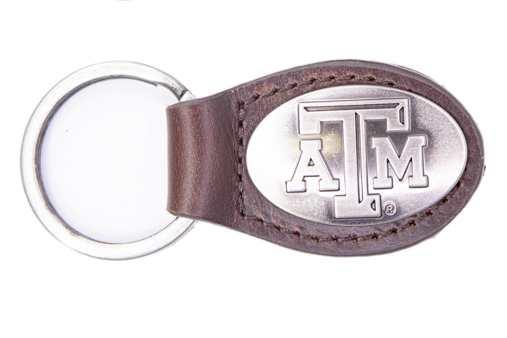 Texas A&M Aggies Oval Leather Key Fob. Sturdy Split Ring and Durable Stitching. Perfect Collegiate Key Chain Gift. Brown or Black Leather.