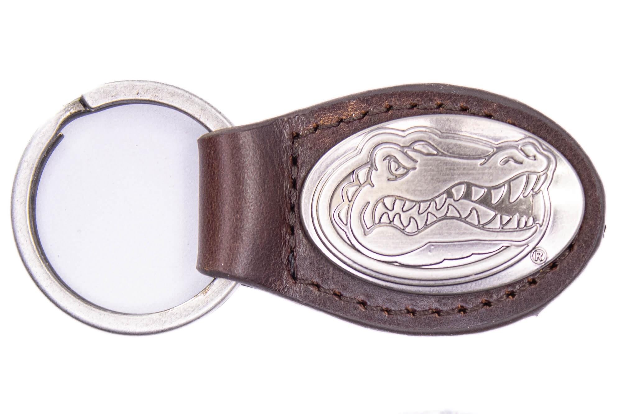 Florida Gators Oval Leather Key Fob. Sturdy Split Ring and Durable Stitching. Perfect Collegiate Key Chain Gift. Brown or Black Leather.