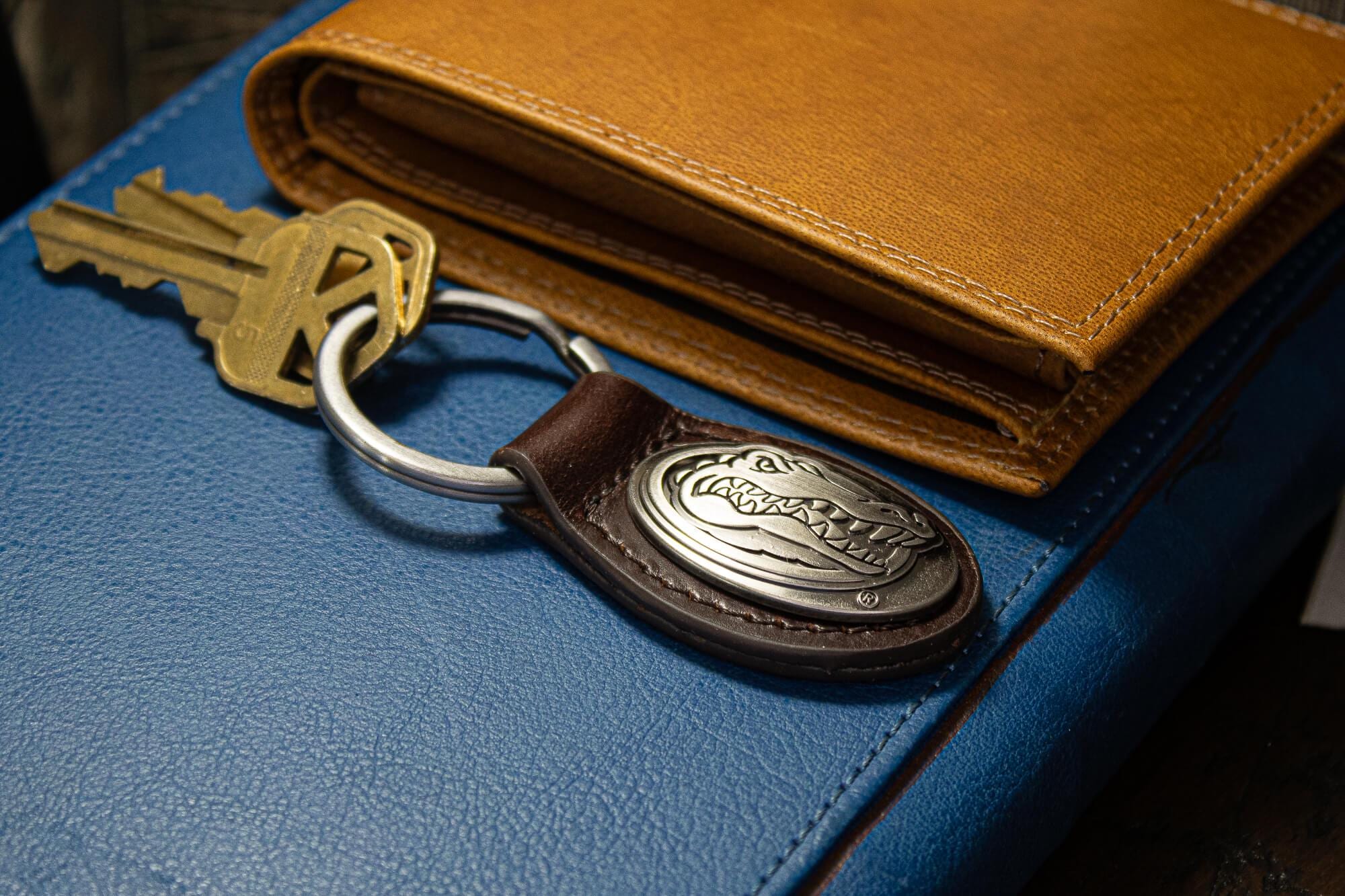 Florida Gators Oval Leather Key Fob. Sturdy Split Ring and Durable Stitching. Perfect Collegiate Key Chain Gift. Brown or Black Leather.