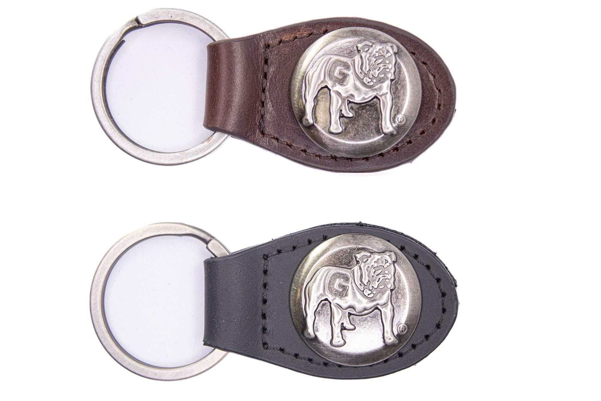 Georgia Bulldogs Oval Leather Key Fob. Sturdy Split Ring and Durable Stitching. Perfect Collegiate Key Chain Gift. Brown or Black Leather.