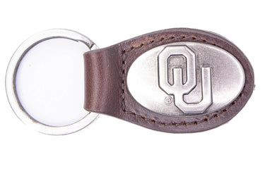 Oklahoma Sooners Oval Leather Key Fob. Sturdy Split Ring and Durable Stitching. Perfect Collegiate Key Chain Gift. Brown or Black Leather.