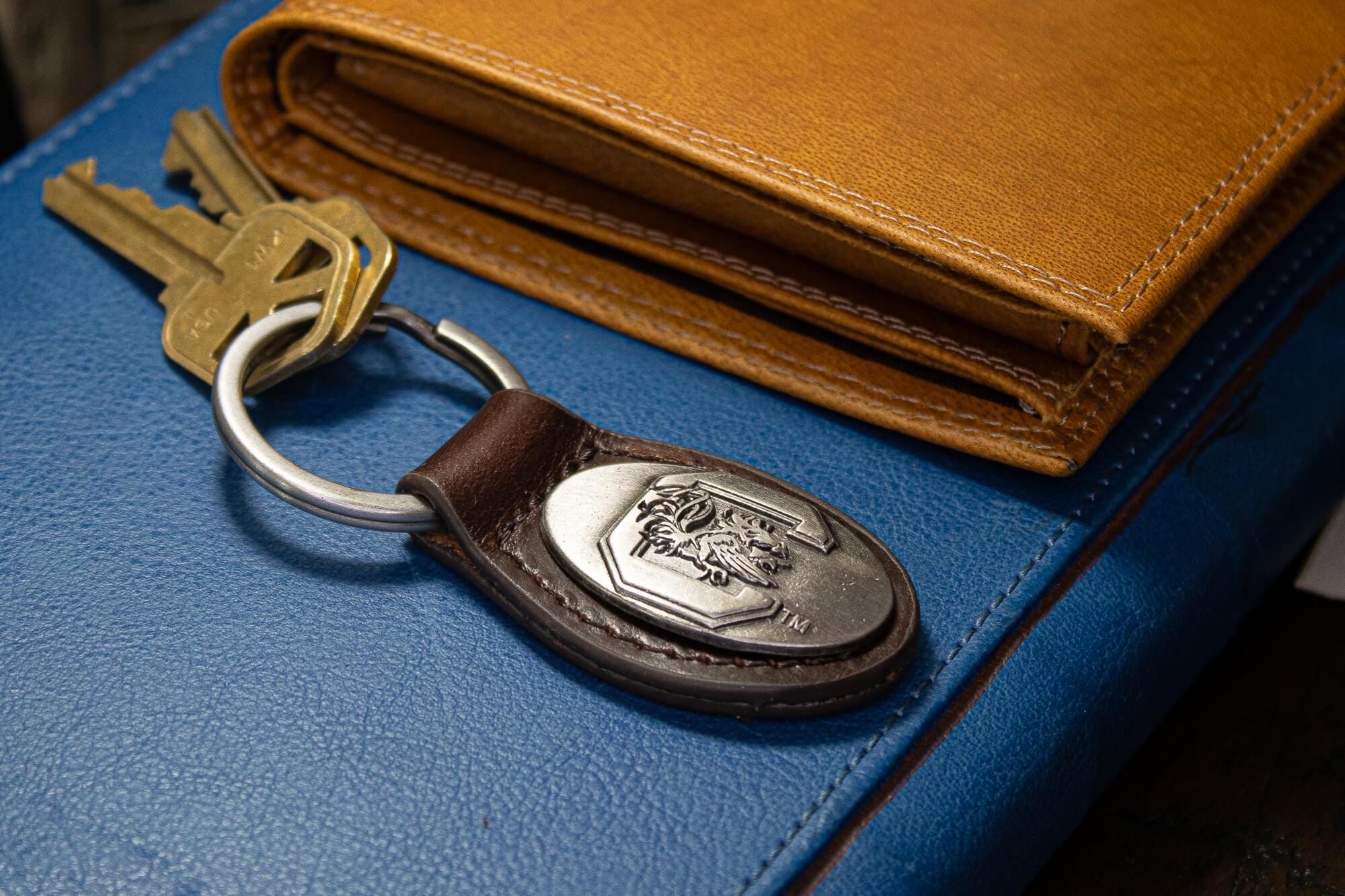 USC Gamecoks Oval Leather Key Fob. Sturdy Split Ring and Durable Stitching. Perfect Collegiate Key Chain Gift. Brown or Black Leather.