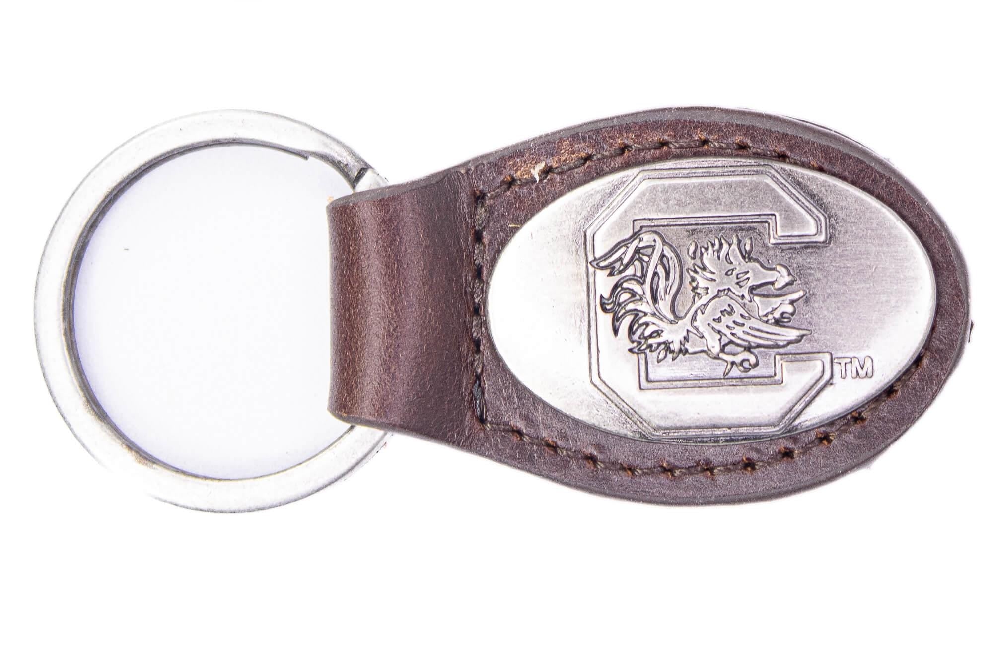 USC Gamecoks Oval Leather Key Fob. Sturdy Split Ring and Durable Stitching. Perfect Collegiate Key Chain Gift. Brown or Black Leather.