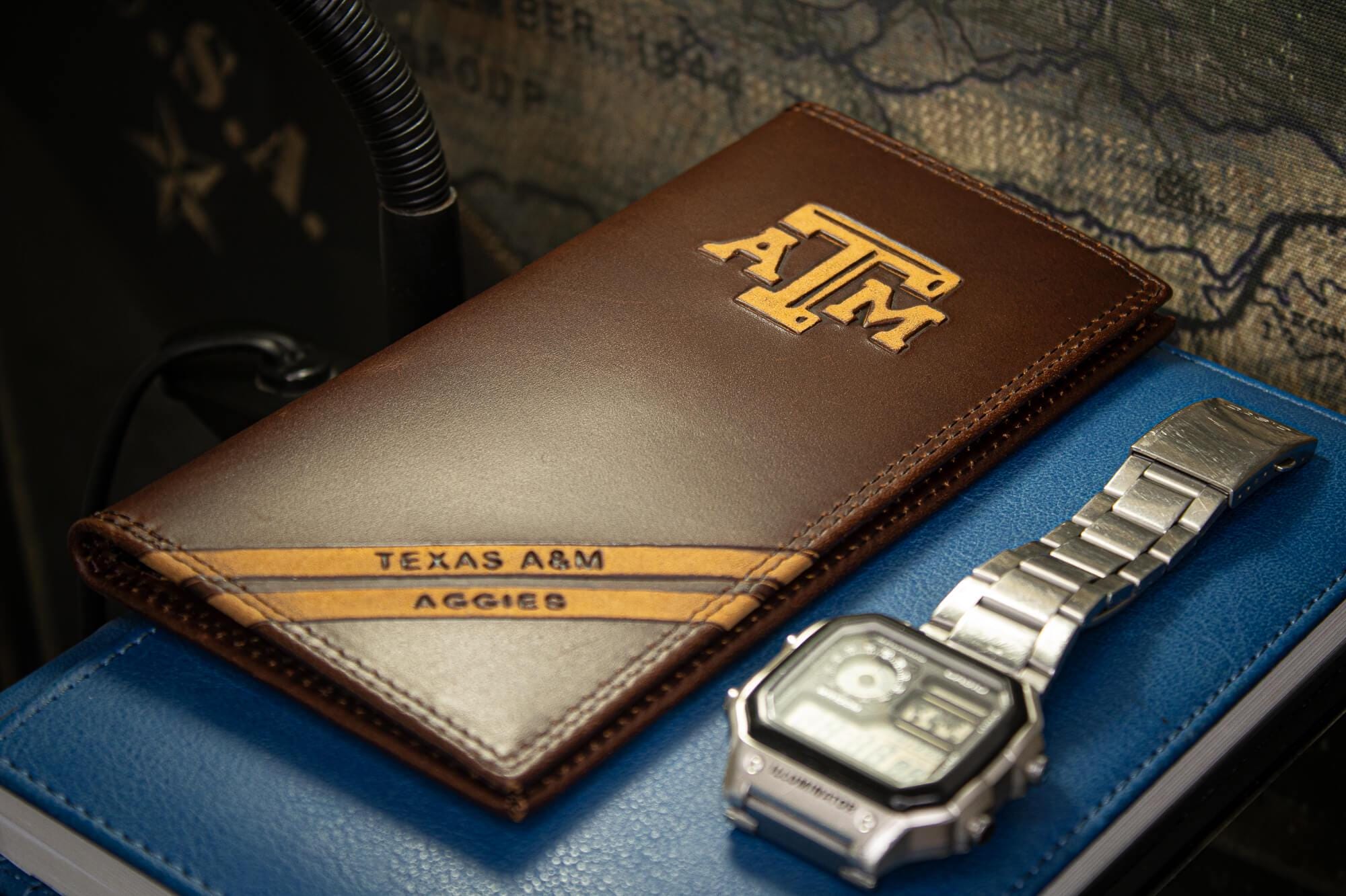 Texas A&M Aggies Men's Embossed Leather Wallet. Texas Trifold. Texas AM Secretary. Brown Collegiate Wallet. Aggies Athletic Print.