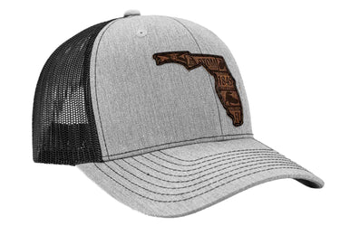 Florida Map Leather Patch Trucker Hat. Burnished Full Grain Leather. Snapback Trucker Hat. Richardson 112 Cap. Florida State Headwear.