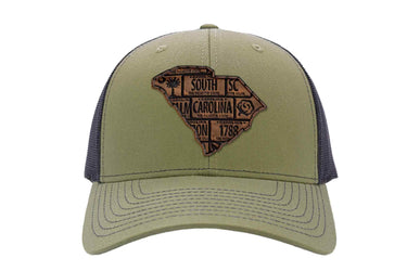 South Carolina Map Leather Patch Trucker Hat. Burnished Full Grain Leather. Snapback Trucker Hat. Richardson 112 Cap. SC State Headwear.