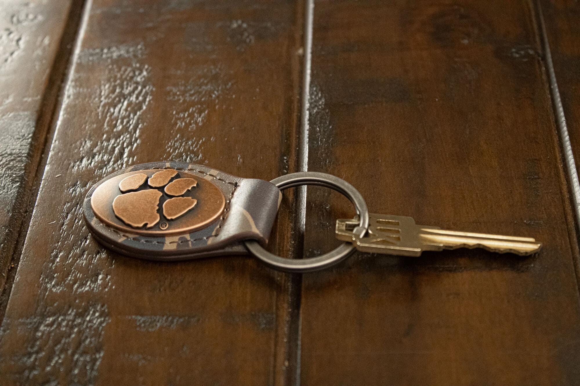 Clemson Tigers Oval Camo Leather Key Fob. Split Ring and Durable Stitching. Perfect Collegiate Key Chain Gift. Old School Camo Key Chain.