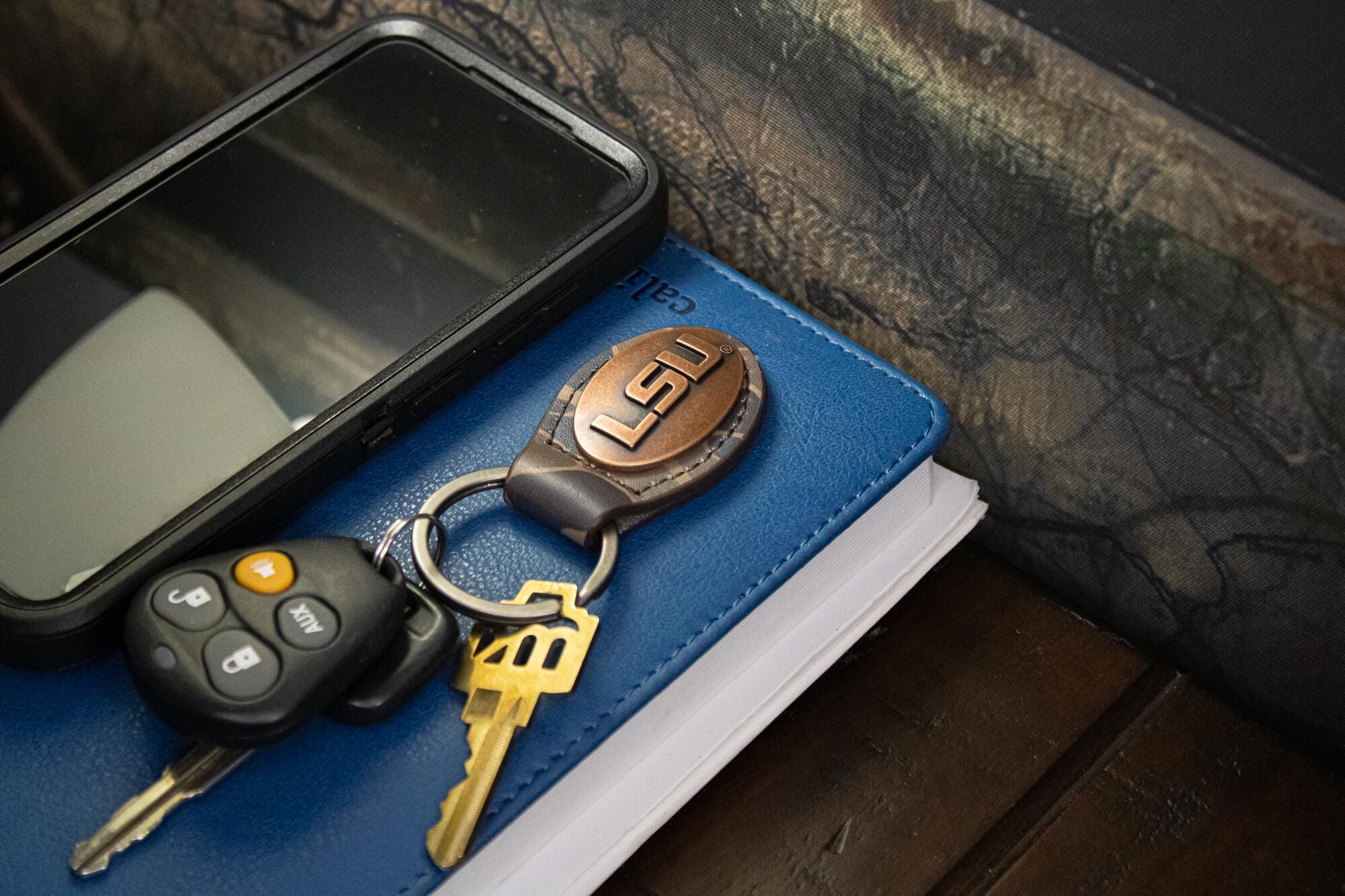 LSU Tigers Oval Camo Leather Key Fob. Split Ring and Durable Stitching. Perfect Collegiate Key Chain Gift. Old School Camo Key Chain.