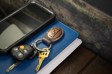 LSU Tigers Oval Camo Leather Key Fob. Split Ring and Durable Stitching. Perfect Collegiate Key Chain Gift. Old School Camo Key Chain.
