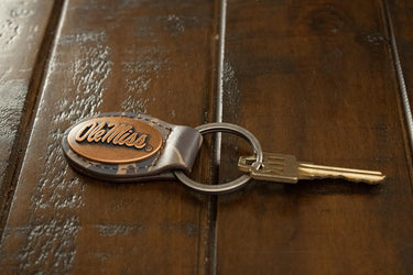 Ole Miss Rebels Oval Camo Leather Key Fob. Split Ring and Durable Stitching. Perfect Collegiate Key Chain Gift. Old School Camo Key Chain.
