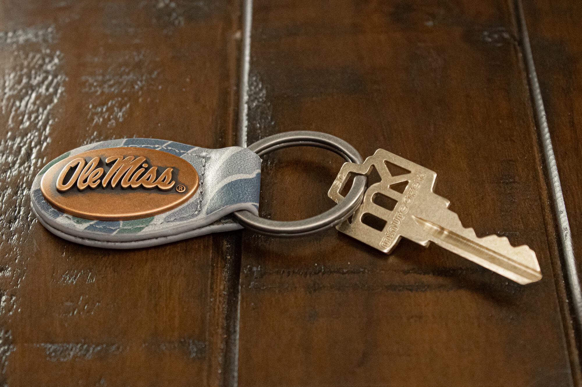 Ole Miss Rebels Oval Camo Leather Key Fob. Split Ring and Durable Stitching. Perfect Collegiate Key Chain Gift. Old School Camo Key Chain.