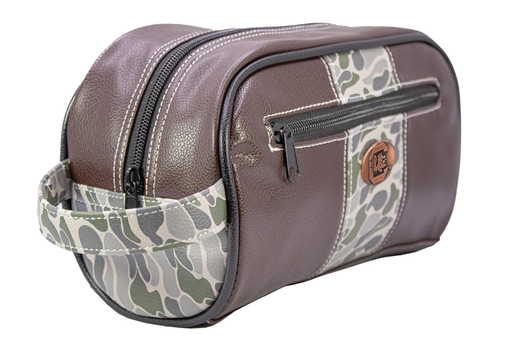 USC Gamecocks Men's Camo Dopp Kit. Toiletry Bag. Old School Camo Print. Brown Pebble Finish. Antique Copper Logo. Perfect Travel Accessory