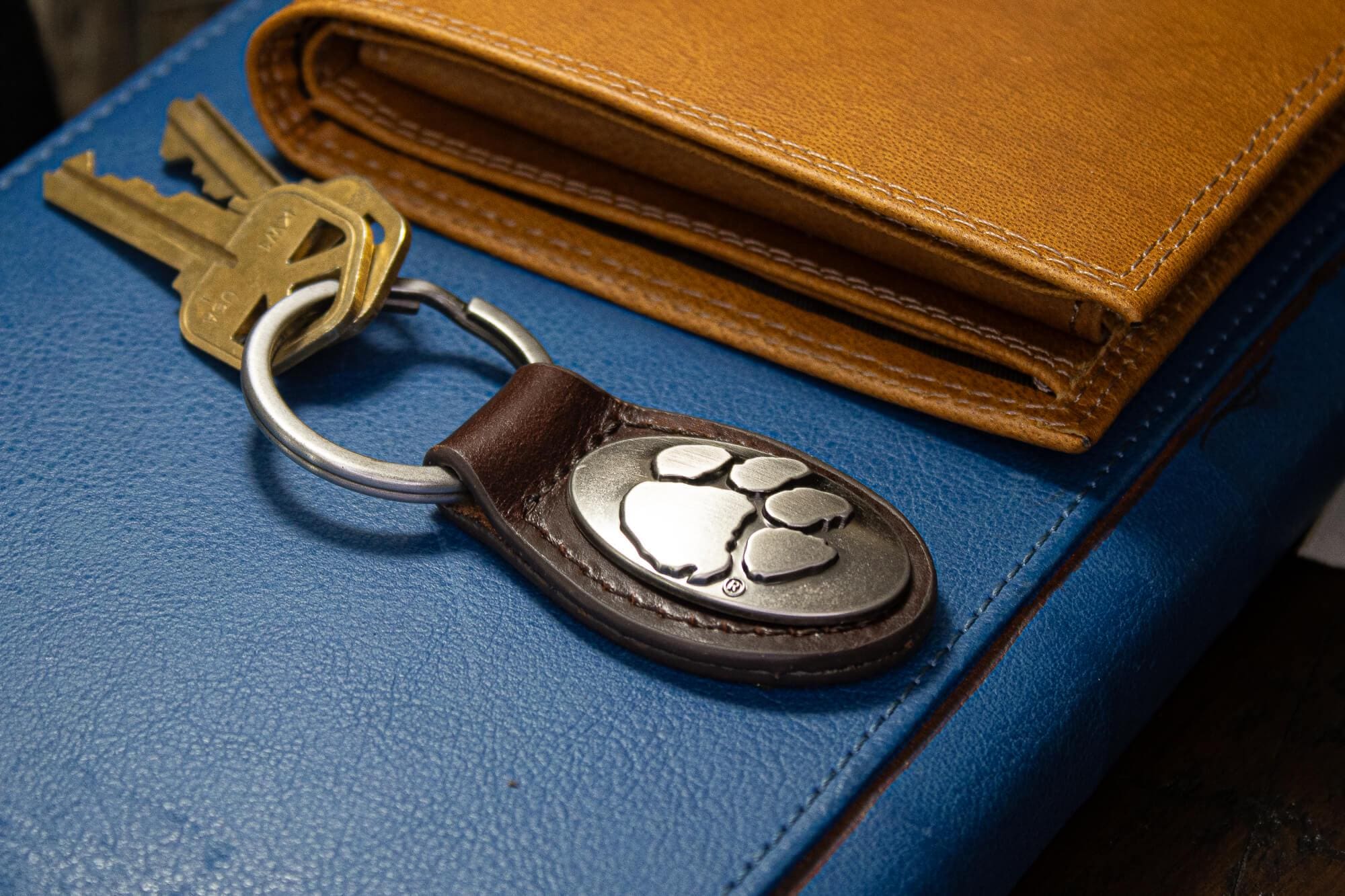 Clemson Tigers Oval Leather Key Fob. Sturdy Split Ring and Durable Stitching. Perfect Collegiate Key Chain Gift. Brown or Black Leather.