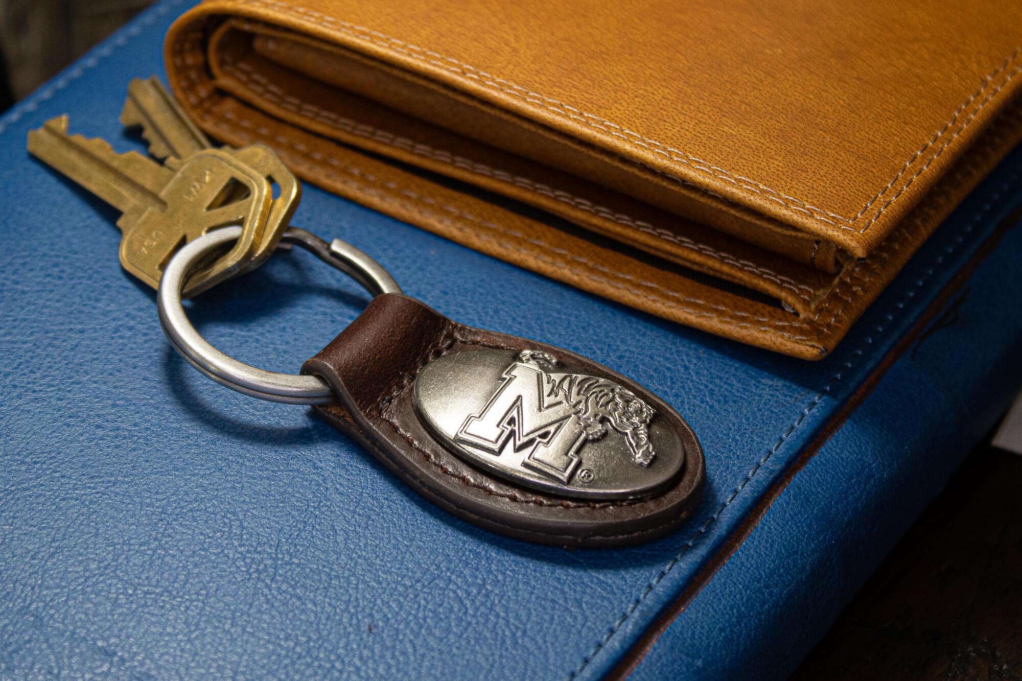 Memphis Tigers Oval Leather Key Fob. Sturdy Split Ring and Durable Stitching. Perfect Collegiate Key Chain Gift. Brown or Black Leather.