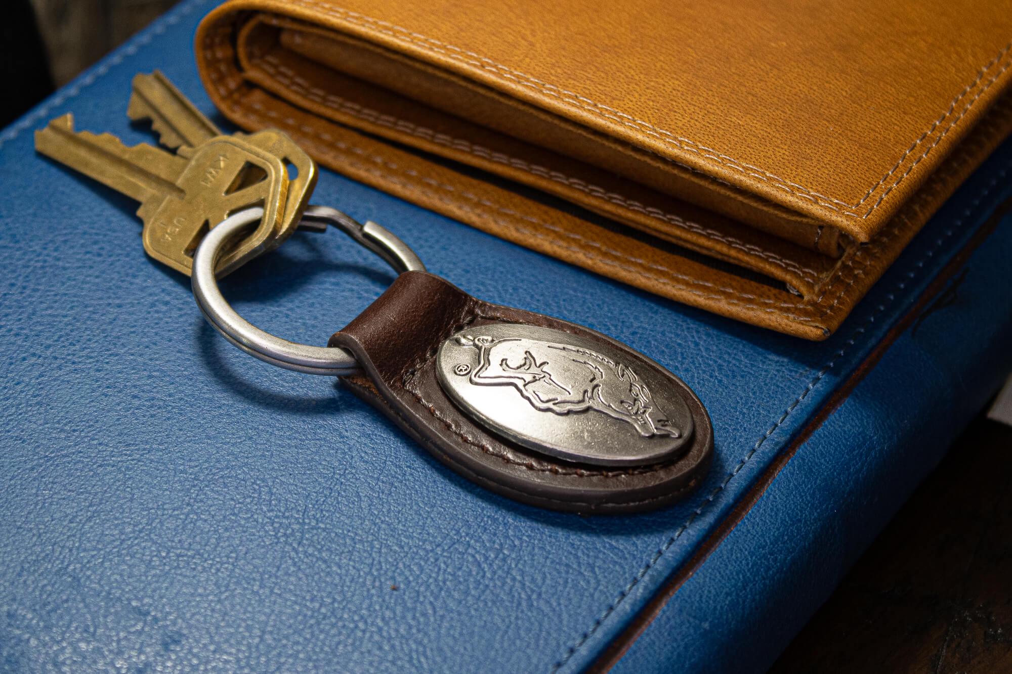 Arkansas Razorbacks Oval Leather Key Fob. Sturdy Split Ring and Durable Stitching. Perfect Collegiate Key Chain Gift. Brown or Black Leather
