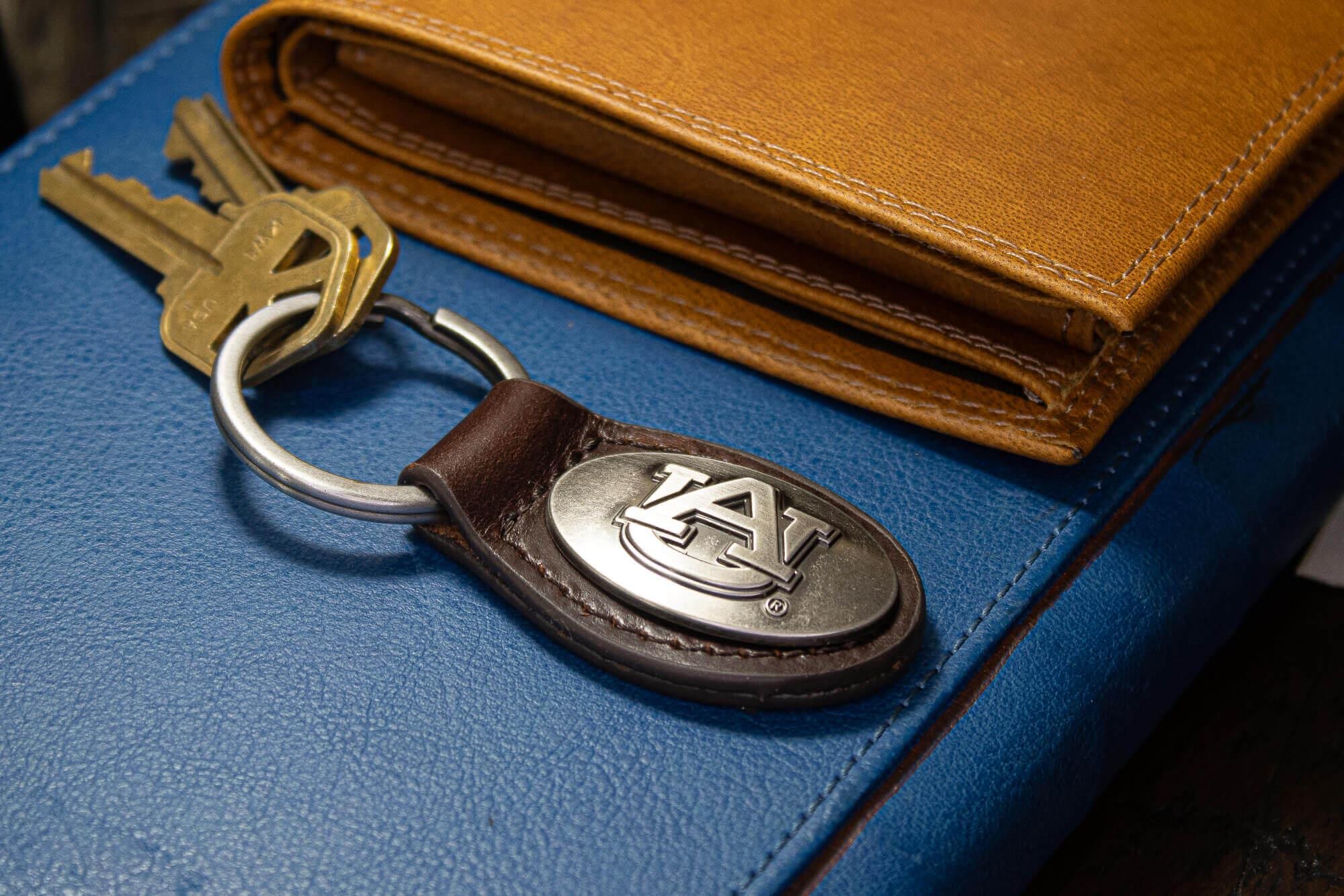 Auburn Tigers Oval Leather Key Fob. Sturdy Split Ring and Durable Stitching. Perfect Collegiate Key Chain Gift. Brown or Black Leather.