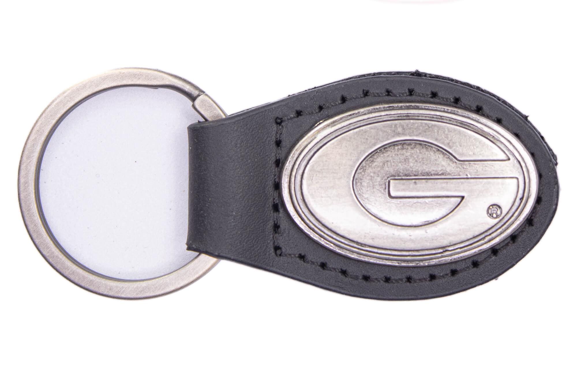 Georgia Bulldogs Oval Leather Key Fob. Sturdy Split Ring and Durable Stitching. Perfect Collegiate Key Chain Gift. Brown or Black Leather.
