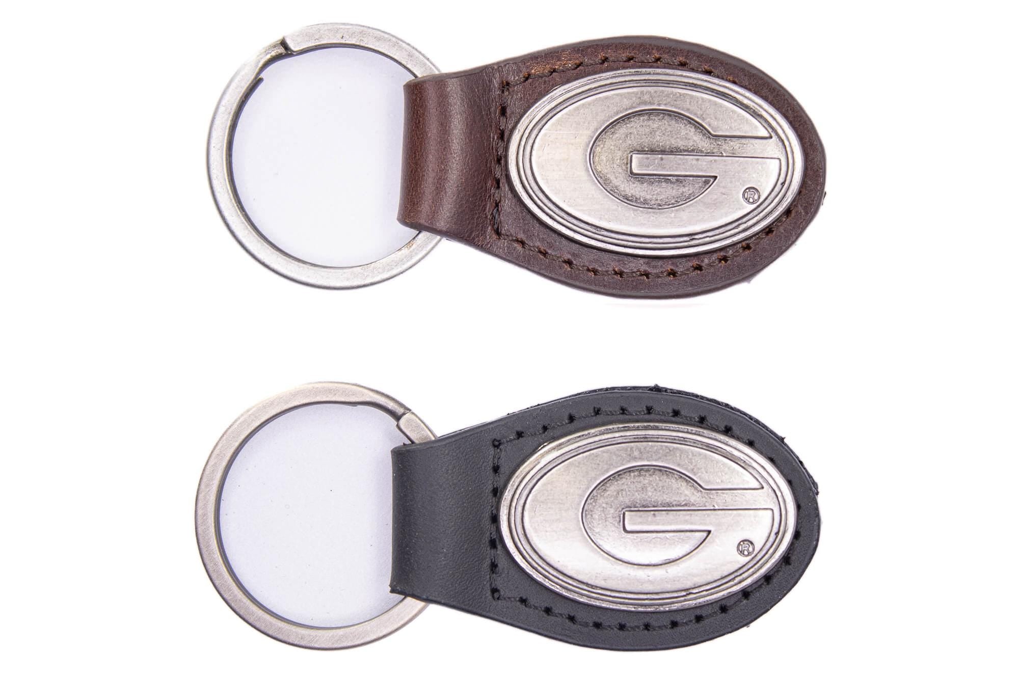 Georgia Bulldogs Oval Leather Key Fob. Sturdy Split Ring and Durable Stitching. Perfect Collegiate Key Chain Gift. Brown or Black Leather.