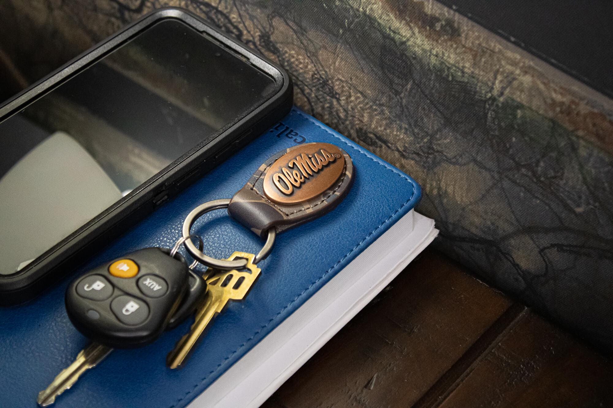 Ole Miss Rebels Oval Camo Leather Key Fob. Split Ring and Durable Stitching. Perfect Collegiate Key Chain Gift. Old School Camo Key Chain.