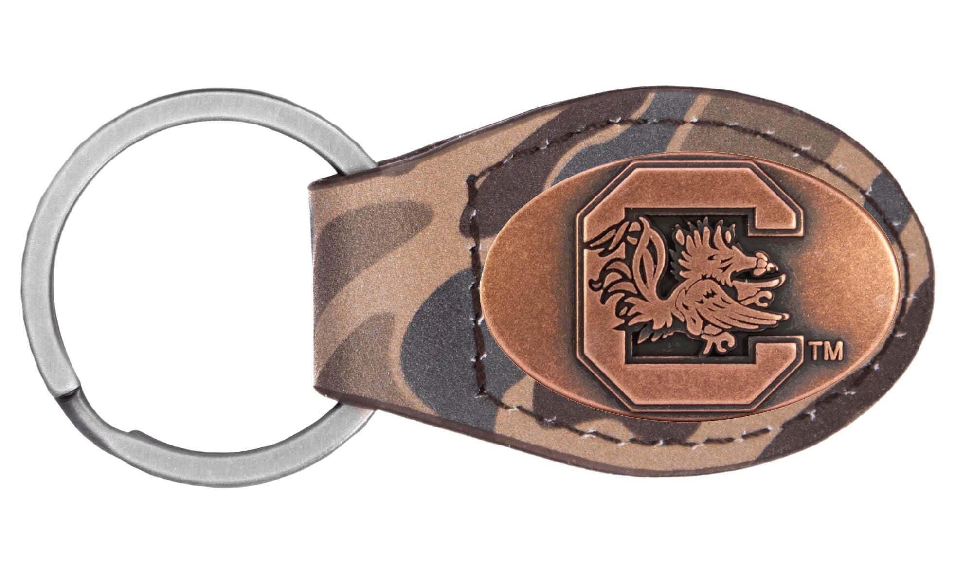 USC Gamecocks Oval Camo Leather Key Fob. Split Ring and Durable Stitching. Perfect Collegiate Key Chain Gift. Old School Camo Key Chain.