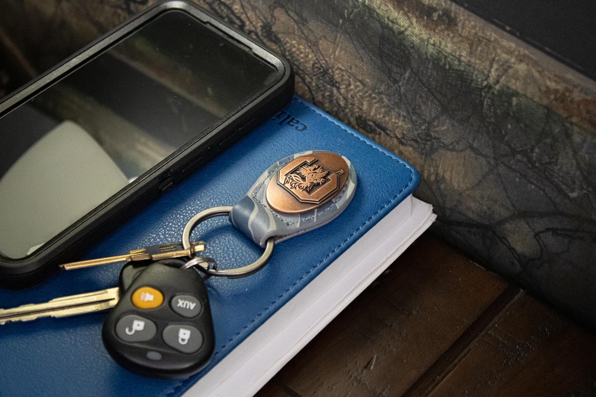 USC Gamecocks Oval Camo Leather Key Fob. Split Ring and Durable Stitching. Perfect Collegiate Key Chain Gift. Old School Camo Key Chain.