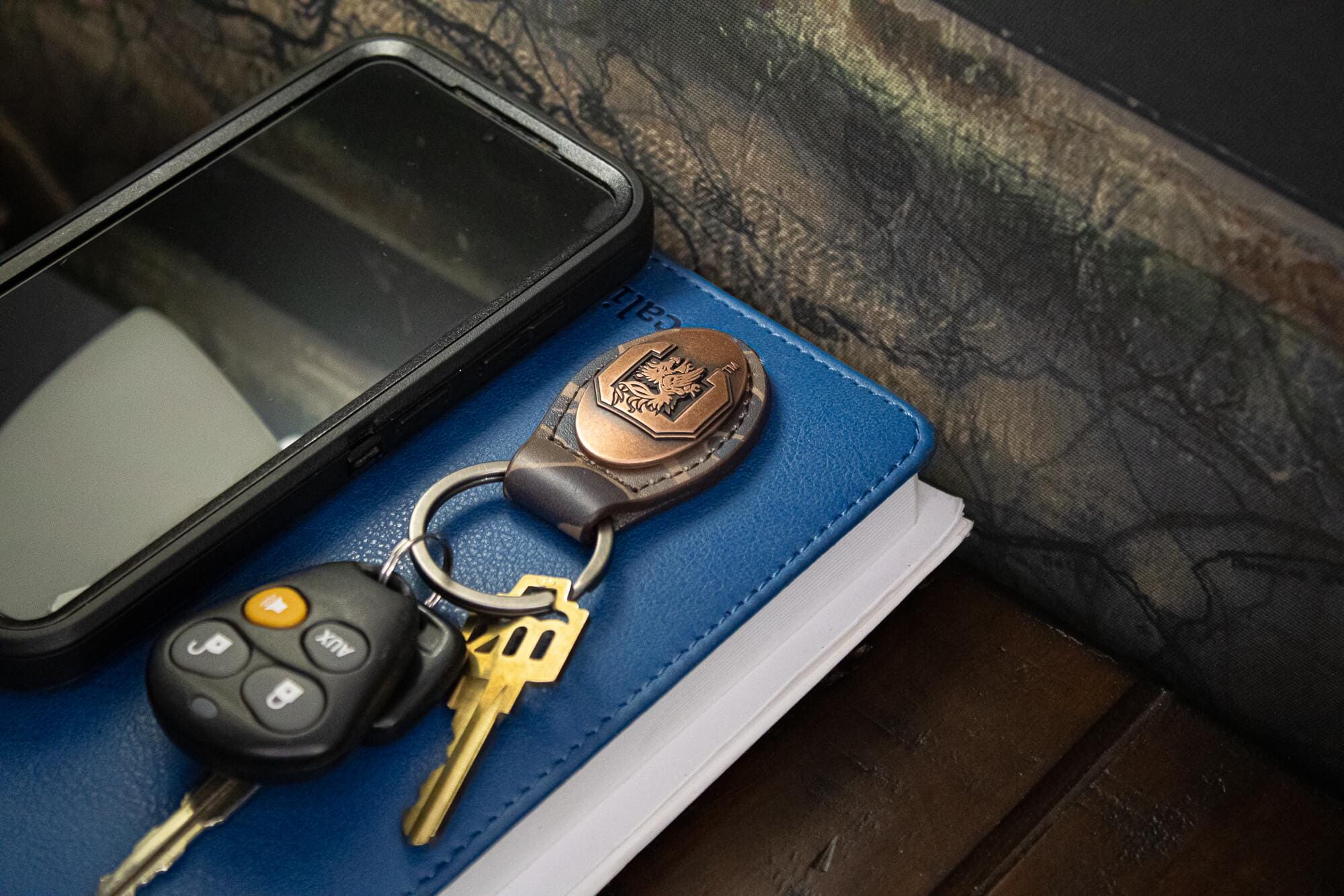 USC Gamecocks Oval Camo Leather Key Fob. Split Ring and Durable Stitching. Perfect Collegiate Key Chain Gift. Old School Camo Key Chain.