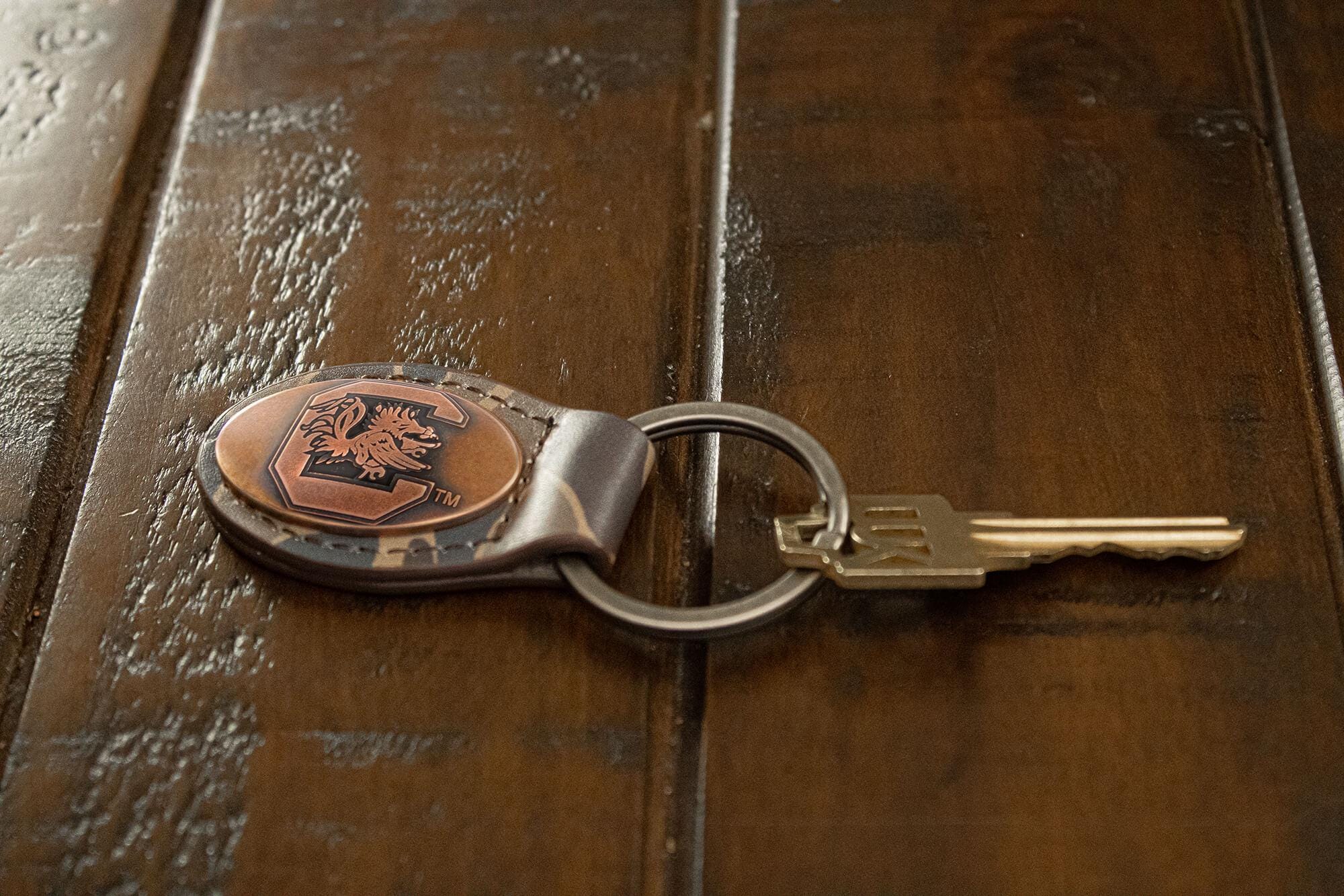 USC Gamecocks Oval Camo Leather Key Fob. Split Ring and Durable Stitching. Perfect Collegiate Key Chain Gift. Old School Camo Key Chain.
