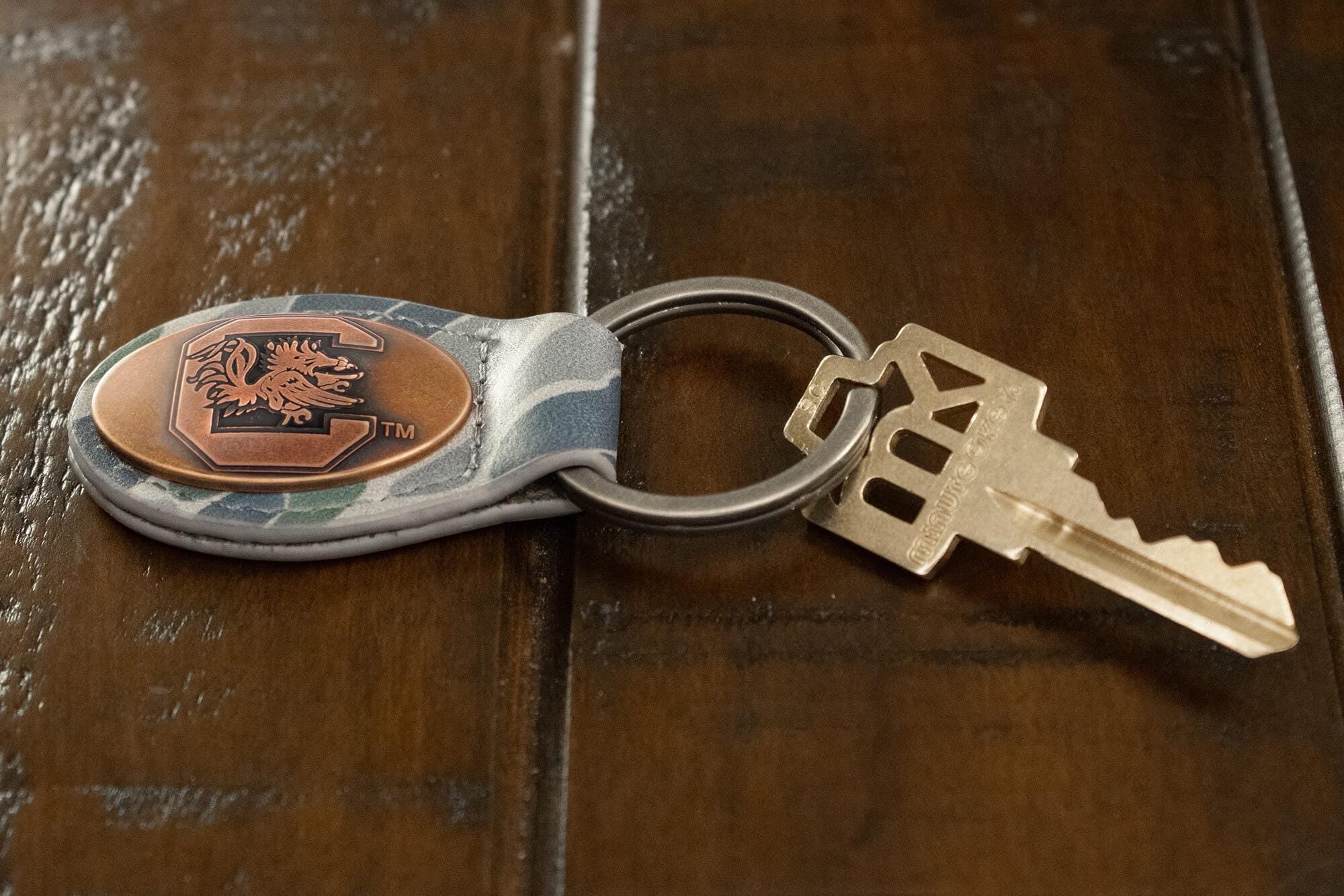 USC Gamecocks Oval Camo Leather Key Fob. Split Ring and Durable Stitching. Perfect Collegiate Key Chain Gift. Old School Camo Key Chain.