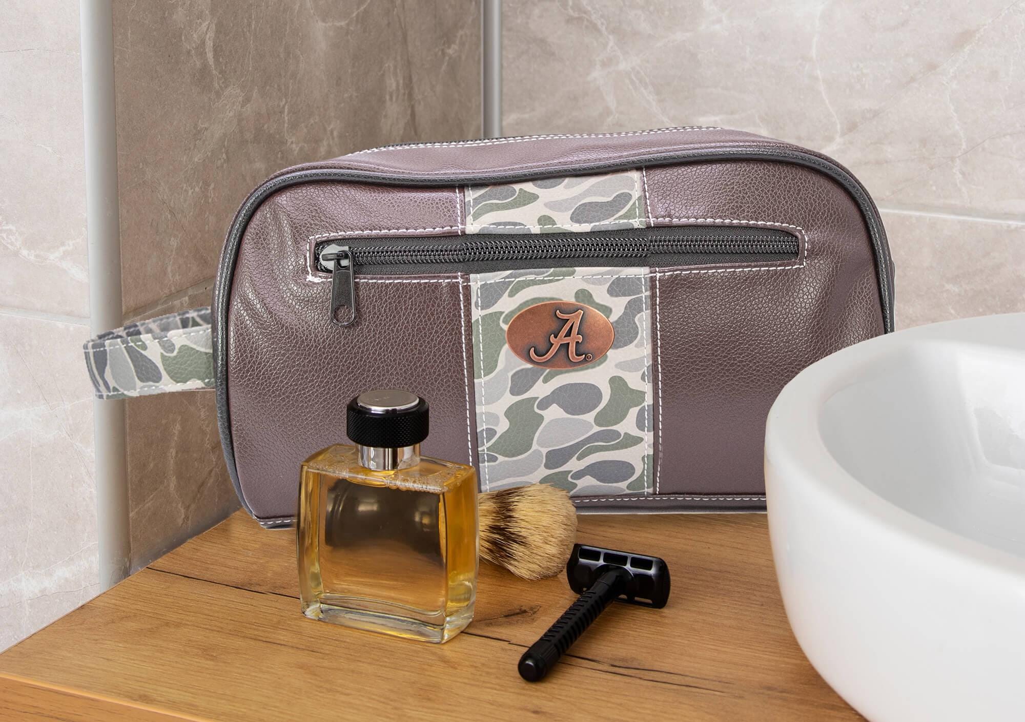 Alabama Crimson Tide Men's Camo Dopp Kit. Toiletry Bag. Old School Camo Print. Brown Pebble Finish. Antique Copper Logo. Travel Accessory